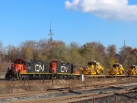 With a couple of veteran GP9RM's leading the 0600 Hamilton Yard Job is returning from their days work with a last minute lift request, six dimensional loads (D2U) from the Harbour Area. The six loaded flats consisted of three Plasser American USP 2005 Ballast Profiling Machines first up followed by three Plasser American Unimat 4X4/4S High Performance Tampers. METROLINX stenciling was prominent on the machines. 