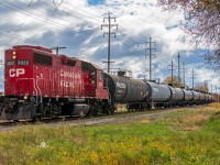 CP 3022 with it's long hood forward, is heading back to the CPKC yard in downtown Winnipeg after switching cars with BNSF.