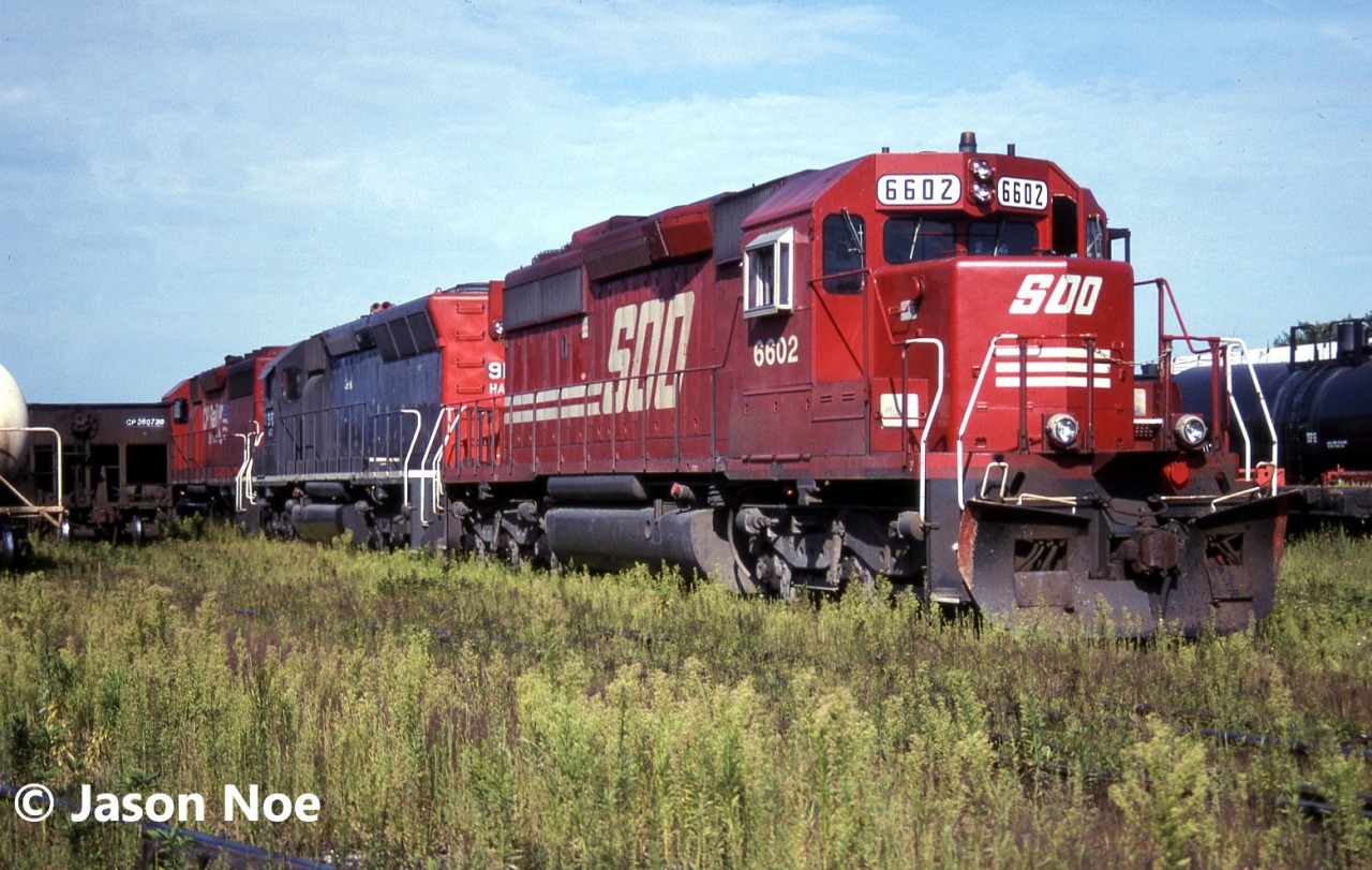 SOO Line SD40-2 6602, HATX SD45R 917 and another CP SD are viewed at CP’s Aberdeen Yard in Hamilton, Ontario. HATX 917, is former Southern Pacific 9106 and was built during 1969. It was eventually acquired by Genesee & Wyoming and became Huron Central Railway (HCRY) 459 in spring 1998. It was later transferred to the Buffalo & Pittsburgh Railroad (BPRR) and became BPRR 459. Several years later it was rebuilt as BPRR SD40M-2 3063 retaining the SD45 style carbody.