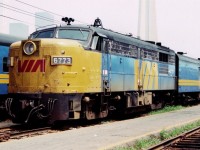 Seen here in August 1983 is Via MLW FP4A 6773 and a Via baggage car at the coach yard near Toronto Union Station. The base of the CN tower looms in the background haze. Ahh the old MLW Alcos - they seemed to be around forever, until they were gone. I saw an internet post that this unit survives in Ohio on the Cuyahoga Valley Scenic Railway?