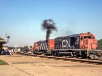 CN 5187 and CN 2035 are by the VIA station in Brantford, Ontario on August 14, 1982.