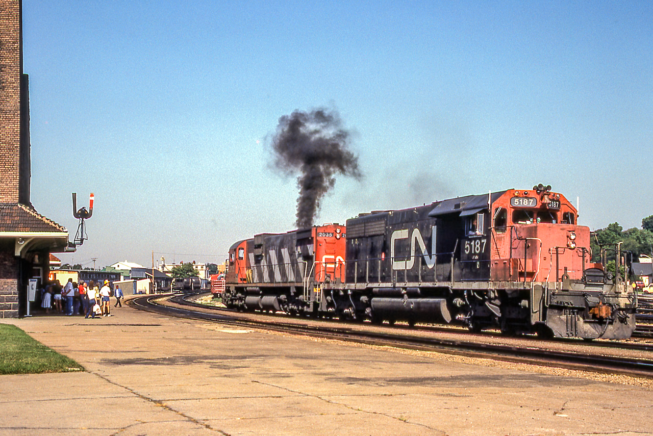 CN 5187 and CN 2035 are by the VIA station in Brantford, Ontario on August 14, 1982.