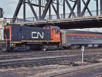 <br>
At that time, an unusual sight:  MLW 1959 built S-13 CN 8519, operated by CN handles ex CP Rail MacKenzie Manor.
<br>
<br>
At TTR Bathurst Street, March 11, 1979 Kodachrome by S.Danko
<br>
<br>
The S-13's were the exclusive power for the CN Spadina coach yard – and most common CN power for downtown CN  / TTR trackage.
<br>
<br>
Noteworthy
<br>
<br>
The initial VIA operation of the ex CP Rail The Canadian commenced October 1978, primarily out of Toronto. While the ex CN Super Continental was  Montreal based. When VIA determined the ex CP equipment would be better serviced  at Montreal, the origination of the two trains was swapped in June 1979. The ex CP Rail equipment did not return, for the most part, to the Toronto area until after the massive 1990 VIA cuts (thanks to Your Federal Government *).
<br>
<br>
 * Your Federal Government(s) killed the passenger trains - multiple times - per the “ forward planning budgets“ by  multiple Feds: the Trudeau ( Pierre brand ) 1982, then the Mulroney ( Brian brand ) government 1989 effective January 1990.
<br>
<br>
sdfourty