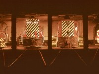 Sunday graveyard shift on 1972-05-28 at the E&N Victoria roundhouse gave me a perfect opportunity to start the second roll of Kodachrome in my week-old Pentax Spotmatic camera, with a collection of locomotives spanning four manufacturers.  From the left in stall 4, MLW S-3 CP 6573, GMD GP9 CP 8679, Baldwin DRS4-4-1000 CP 8008, and in the backshop beyond stall 1, Budd/CC&F RDC2 CP 9199.

<p>Through the distant open door to the left of 8679, the shop steam generator that was in my post last week can be seen.

<p>This was an early colour night shot for me, minimal knowledge of reciprocity effect, and completely ignorant of possible lens filter effects.  Learning came fast!

<p>A very Merry Christmas and Happy Holidays to all.