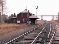 It is hard to keep track of what I have posted and what I have not.  I do not remember this one going to RP.
Anyway, a nondescript sort of day, and I am out at the old Zorra station, hoping for some action.  This view is looking east along the Galt sub; with Lafarge structures visible as well as the line to Ingersoll on the right.
Most of what you see other than the main line is long gone, although Lafarge (concrete) still operates here. The station was a classic. Heck, it could boast two oil tanks !!! That is a lot of heating. No wonder it was demolished.
This is my last contribution for 2025. Happy New Year, everyone.