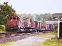 Back in the days when the massive MLWs were the pride of the fleet, we see a pair of M-636s and a C-424 powering a train about to take the Dundas sub and head up the Copetown hill westbound. Power is 2319, 2309 and 3227. Those were the good times !!