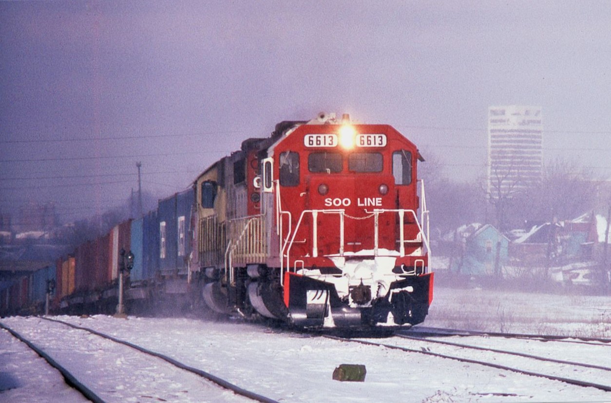 SOO SD40-2's 6613-6614 claw there way up and out of the Detroit River Tunnel with CP Train 500 from Chicago to Montreal. The train will pass the CN Windsor South (Former CR/PC/NYC) depot before turning down the Electric Yard lead towards Lakeshore and onto the CP Windsor Sub.