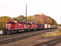 The fall colours are beginning to kick in around Parry Sound. That's one of the reasons for the visit to this lively community of 6,000 people. The main reason, of course, is to see trains.
I'm on the south side of the tracks by the entrance to the small Parry Sound CP yard and grabbing a pic of CP 5904, 5721 heading toward Toronto.
So much has changed. It is but a single track thru here now. The station, now repurposed, can be seen in the background.