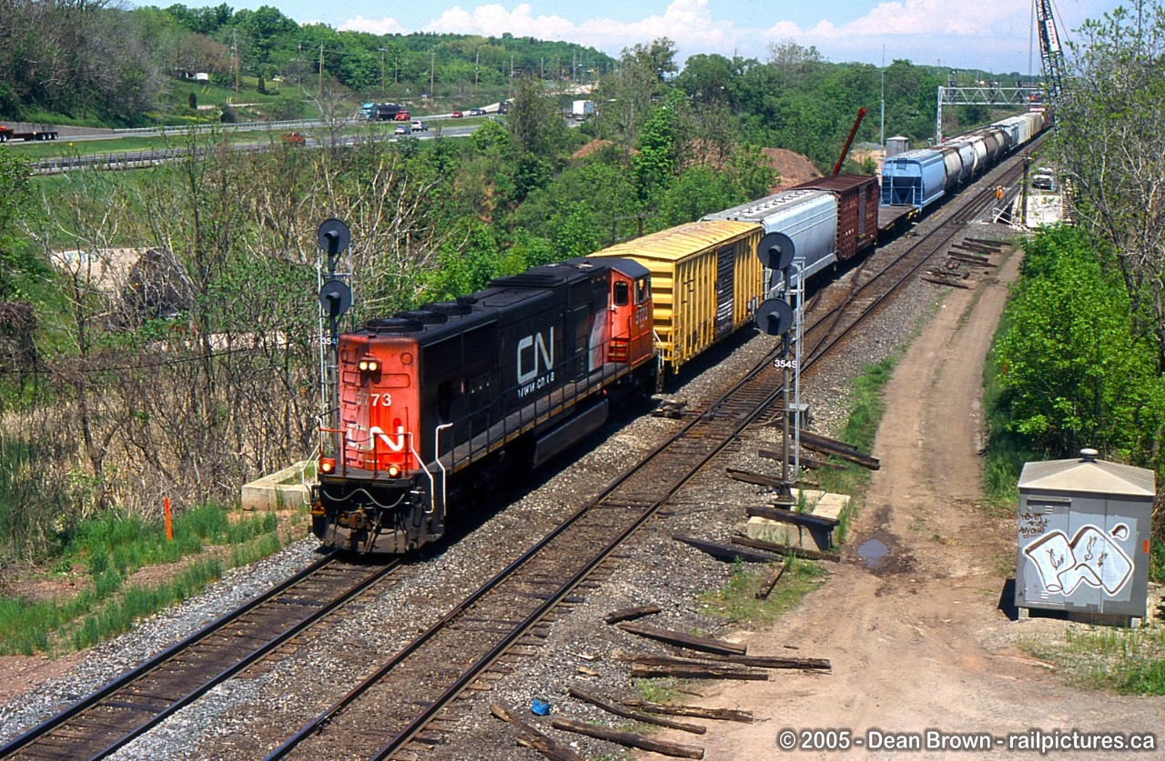 CN SD75I 5673 running long hood forward leading 431.