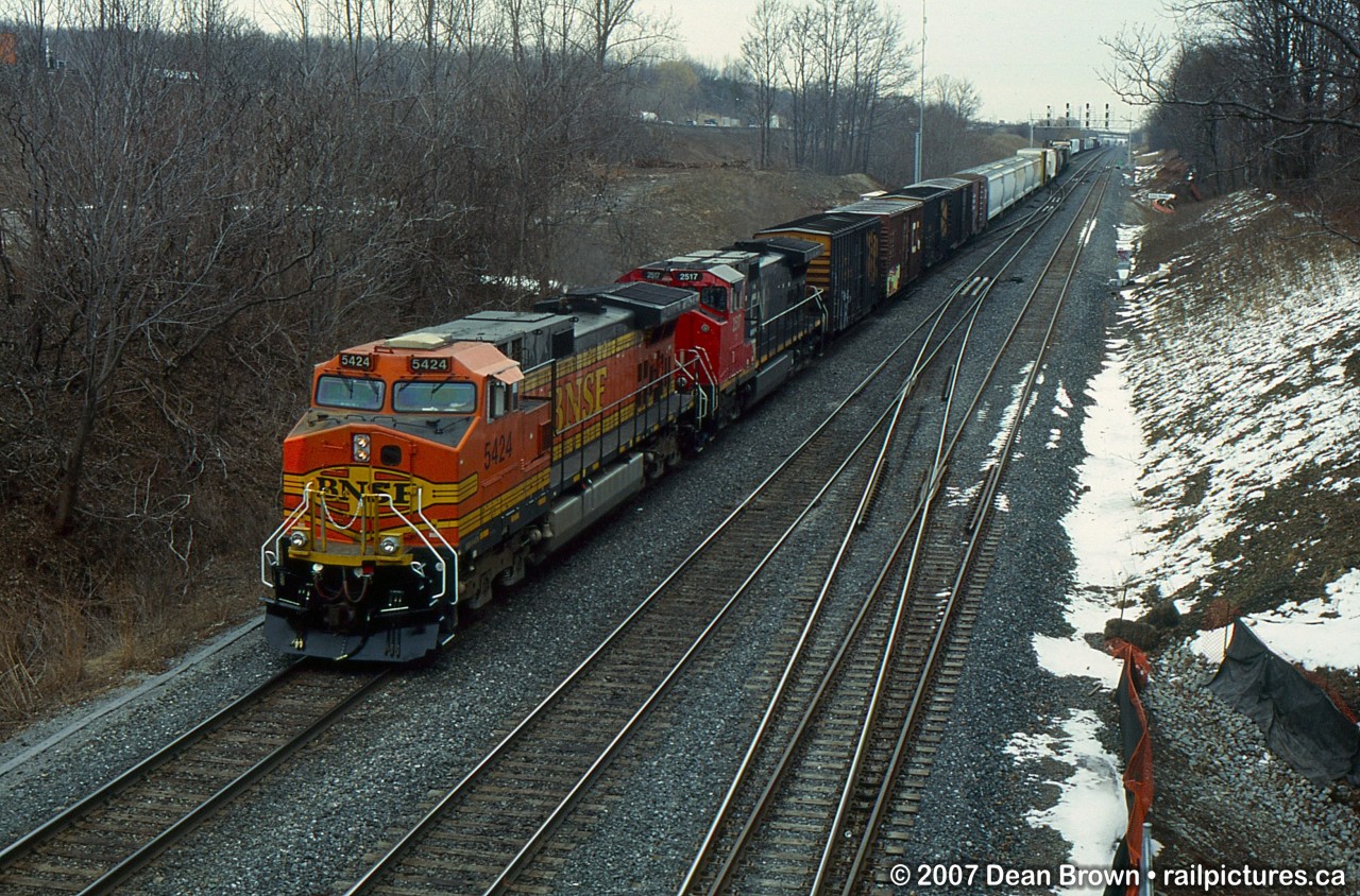 385 with BNSF C44-9W 5424 and CN C44-9WL 2517.