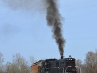  Smoking up like a nice old MLW unit should, Trillium 108 works a cut of cars at that diminutive yard down by the former Robin Hood facility. The old warrior put on quite a show.