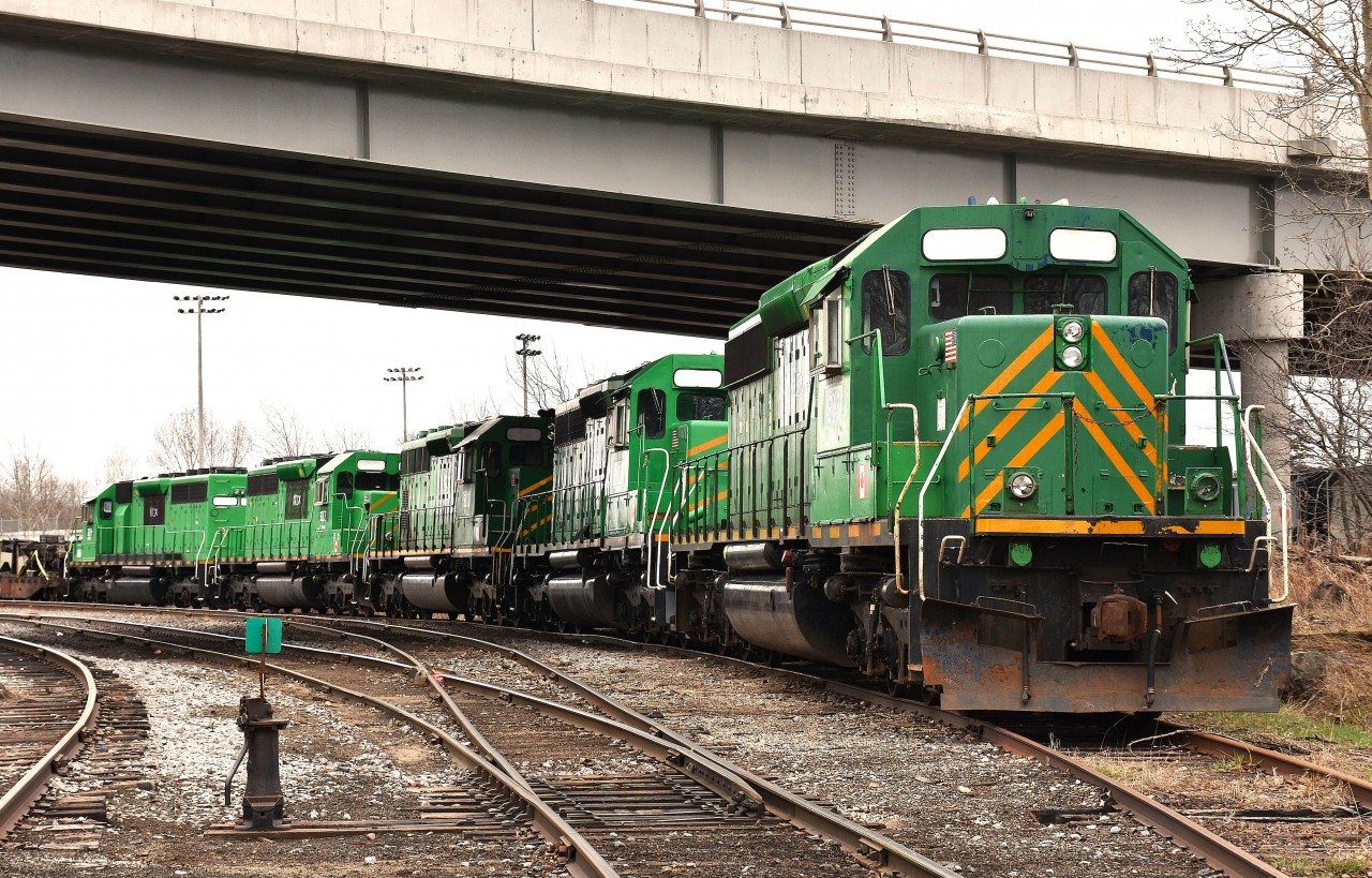 Sitting just to the northwest of the ONR's main shop complex, and under the Hwy 11B overpass were five former New Brunswick Southern GP40-2s. Apparently they had been sold to KKIX for scrapping. My assumption is they are going to be scrapped in North Bay. ( a stop there in Sept showed no sign of them) The units are KKIX 3003, 3000, 3001, 3002 and 3004. On the NBSR they toiled as 8144, 6315, 6319, 6340 and 8145.
Perhaps someone who frequents the area can confirm if they are now scrapped (maybe in the process of..) or are way back in the yard, which is congested to the point it is hard to spot anything, even from up on the highway bridge.