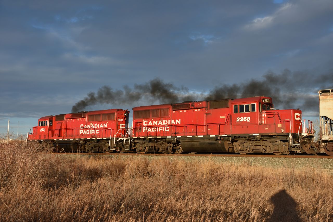 Two GP20C-ECO units 2321-2268 accelerate their short train over to work at Ogden Yard. Not at all looking very ECO, 2321 does its best impersonation of 2860 with a nice cloud of black smoke.