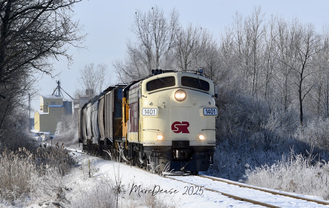 Having gone down to Putnam, ON., light power to pick up 6 hoppers, OSR 1401 leads the Woodstock job back east on a crisp morning complete with a nice coat of hoar frost at Five Points.