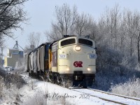 Having gone down to Putnam, ON., light power to pick up 6 hoppers, OSR 1401 leads the Woodstock job back east on a crisp morning complete with a nice coat of hoar frost at Five Points.