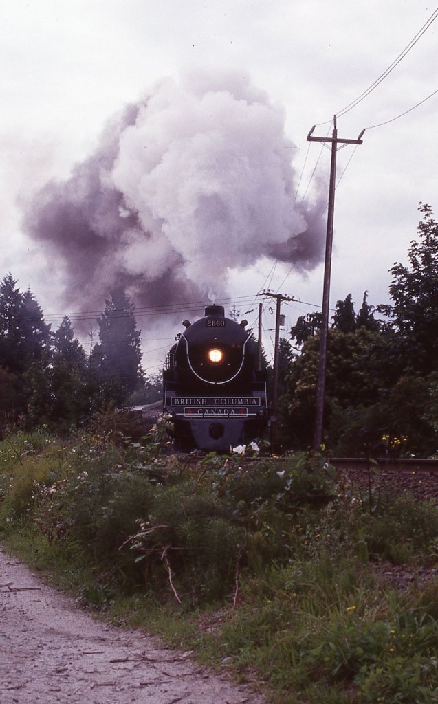 On a beautiful August morning in 1999, former CP Royal Hudson 2860, now British Columbia 2860, roars northbound on the Squamish Subdivision in rural North Vancouver putting on a magnificent display of sound and smoke.