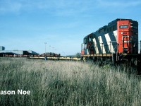 During a pleasant fall afternoon, the CN 15:30 Kitchener Job is busy switching the large Budd automotive frame plant in Kitchener, Ontario with GP9RM 4131. Every weekday afternoon, the job would traverse the Huron Park Spur to service the plant, lifting the loaded frame cars and setting-off the empty flatcars. 