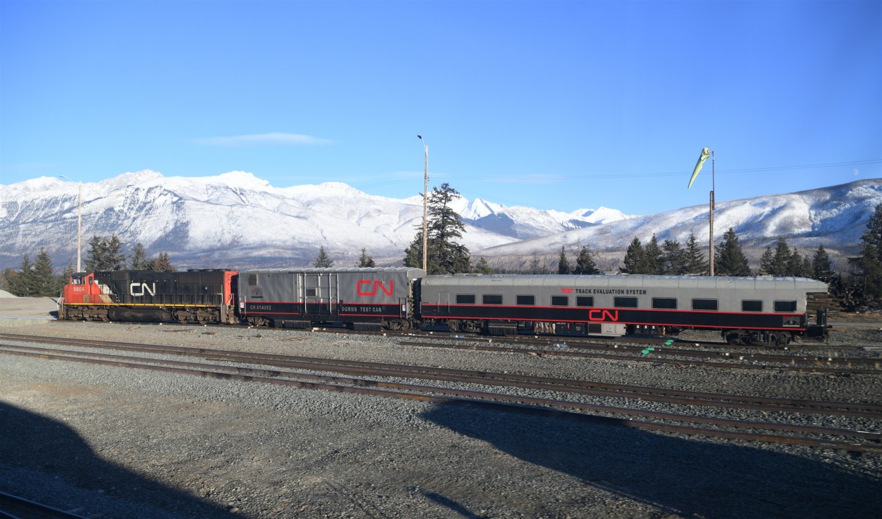 CN TEST  
On an absolutely gorgeous late November afternoon, CN's track geometry TEST train is ready to depart the east end of Jasper Yard onto the Edson Sub. right behind VIA 002 The Canadian. 
The trailing car in the consist CN 1057 TEST 'Daphne' has enjoyed a good long life at CN. Prior to being converted to a TEST car, it was ex-CN 96 Louis Jolliet, exx-CN 99, nee-CN 21, a Class PV-79-D, 79' 0" Business Car, NSC built in 1959.