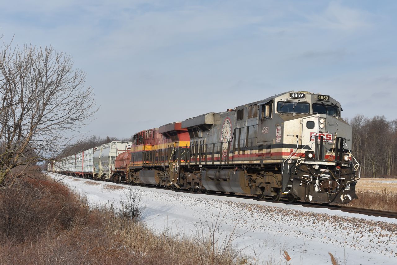 KCS 'Silver Safety' unit KCS 4859-KCS 4765 leads CP#236 approaching Welland Yard