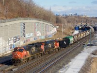 CN 527 has a cut of GWRS hoppers up front as it crosses over at Turcot Ouest.