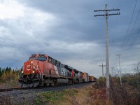 A common occurence on the Mont-Joli subdivision, CN 2294, a DC powered GEVO, leads train 402 towards Mont-Joli, at the Joseph-Paradis road crossing.While the power is quite short of interesting, i thought the picture was worth keeping due to the dramatic cloudy skies up above, and the fact that i timed and framed the picture just like i wanted to.