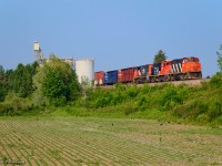 Highballing home to Kitchener, L540 whips past P&H Shantz Terminal with cars from Gillies Lumber in Galt.