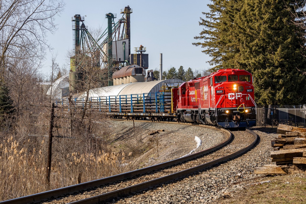 The More You Know
CP 9017 takes the lead in day 1 of a multiple day CWR train on the Hamilton sub back in March of this year. Everything on the railway is a gamble, as I was operating on a hunch that the train was going to run on this day, but I took it as it would of been my first time seeing a Canadian Pacific barn leader
Lord and behold, I had woken up to a text that one of my buddies was on the train, and the game was on. After getting held up by 3 trains before heading down the Hamilton sub (no surprise there), it slowly leans along Waterdown North after dropping rail a few hundred meters down the line where I was standing 
But, just a few months after, I discovered that there is a station (now used as an office) behind where the lead units are in the frame. I totally did not notice this as the trees were blocking off most of the structure from me as I waited for the train to finish dumping rail

Click here for Steven Host's better angle of the station with a northbound train