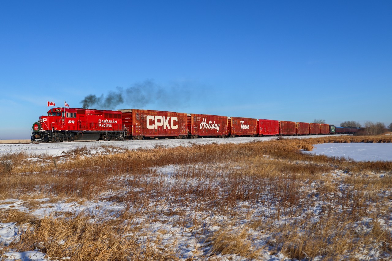 With the show in Camrose over, the Holiday Train throttles up after meeting an eastbound at Ervick on the Wetaskiwin Sub. Next stop is Wetaskiwin on their way to Red Deer.