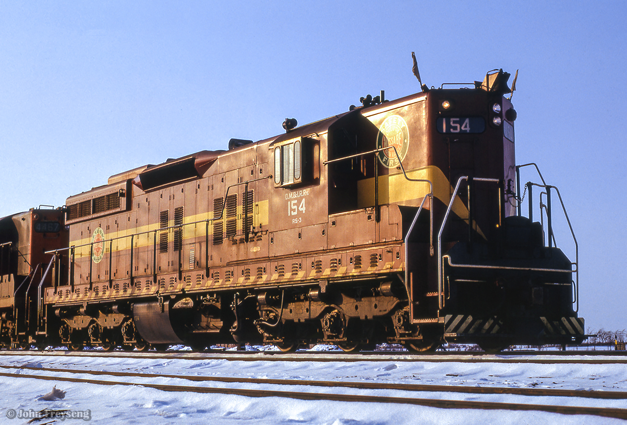 Sitting at the east end of CN's Belleville yard, leased DM&IR SD9 154 sits ready to head up an eastbound extra freight, departing shortly after the arrival of train 5, the Lakeshore.

During the winters beginning 1963-1964 through the winter of 1973-1974, DM&IR SD9s and SD18s were often leased by CN, as well as CP and other lines, to fill out power shortages. The winter of 1965/66 saw CN leasing 20 units.

Scan and editing by Jacob Patterson.