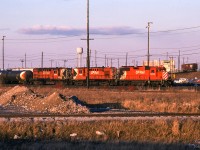A westbound freight behind a GP35 and a pair of RS10s prepares to depart Agincourt Yard.

<br><br><i>Scan and editing by Jacob Patterson.</i>