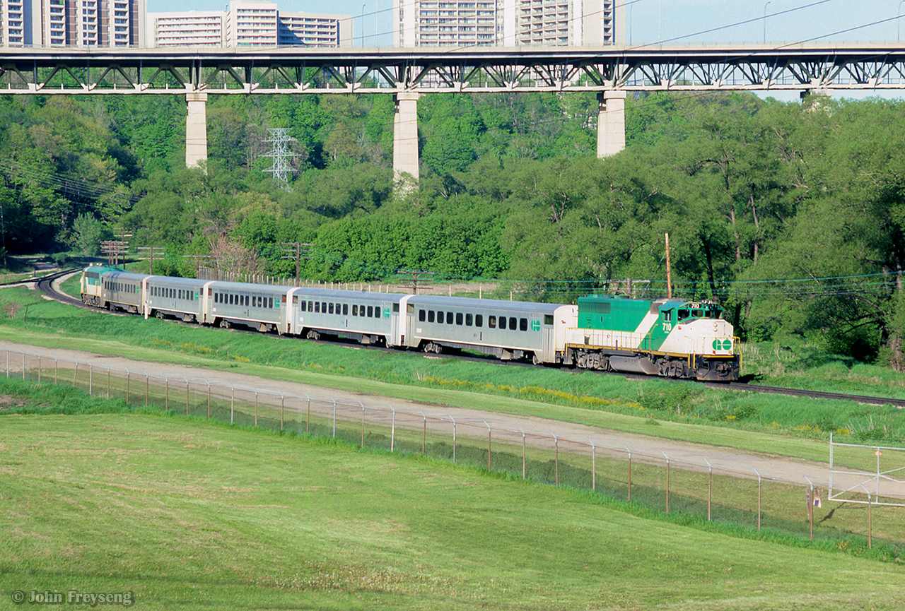 GO 710 leads its train southbound along the Bala Sub at Millwood Road.  Note the spur off to the North Toronto Wastewater Treatment Plant.  APCU 907 brings up the rear.

Scan and editing by Jacob Patterson.