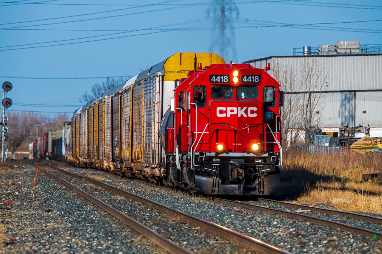 One of the final nice fall days in Southern Manitoba. The crew is rolling through the St. Boniface neighborhood on their way to their daily Paddington yard job.