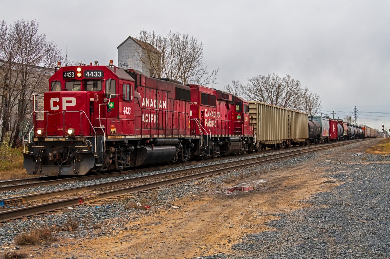 Rumbling through the neighbourhood of St. Boniface, CP 4433 leads the way back to the CPKC Higgins yard after their daily Paddington Yard job.