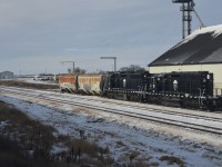 <b> Grain train </b> <br>
PHLX 8 and PHLX 13 shuffle a couple of grain hoppers within the confines of the Parrish & Heimbecker, Limited grain elevator yard trackage at Oban, SK situated at Mile 8.6 on CN's Wainwright Sub.
