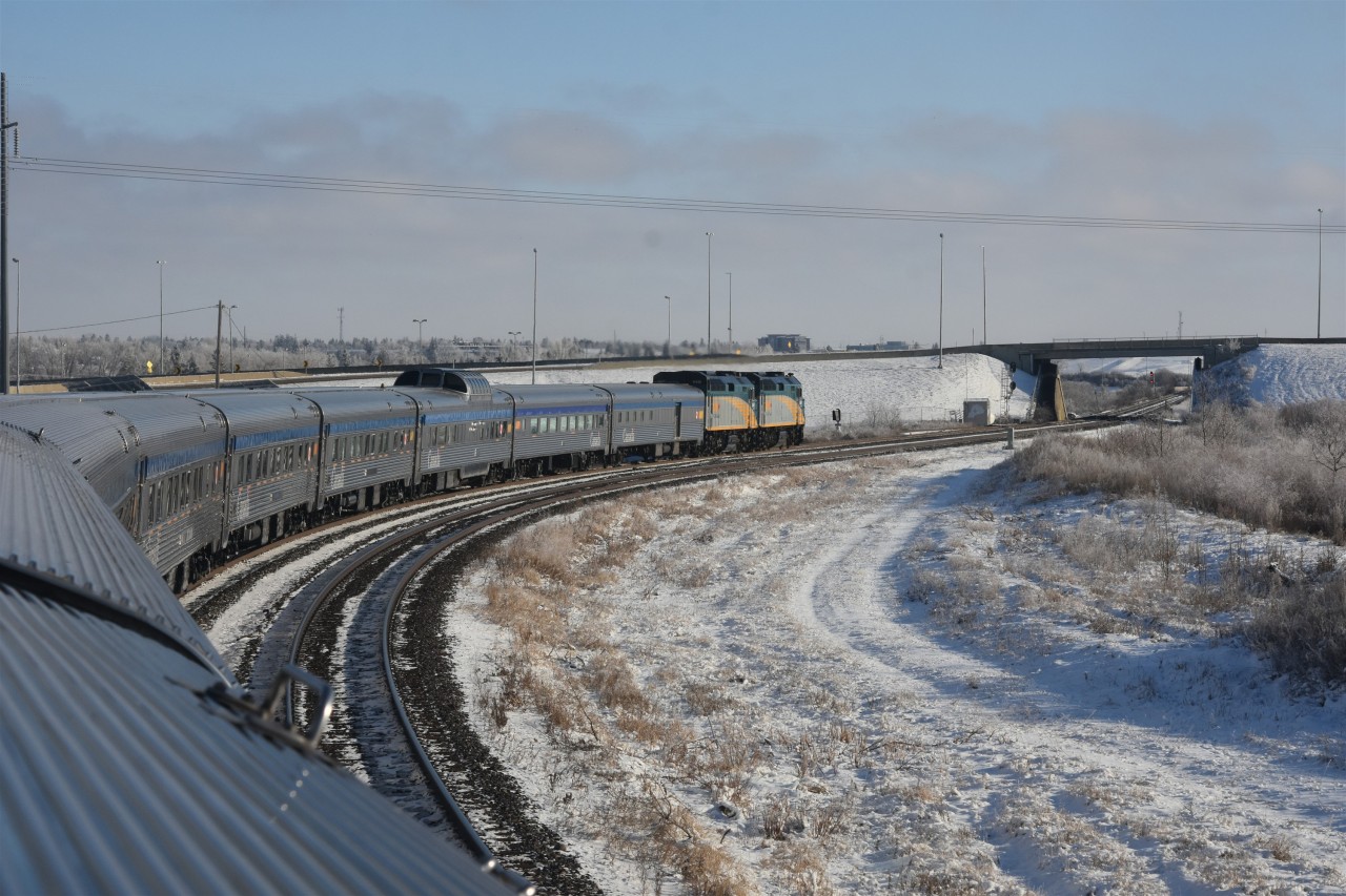 Departing Saskatoon  
VIA 2 has left the station track at Saskatoon, SK and is on the main to continue its eastward journey on this bitterly cold November 30, 2025 afternoon. 
By the end of the journey, we were running 7 hours late, arriving in Toronto at 21:30 
There's nothing wrong with extra hours on The Canadian. :-)