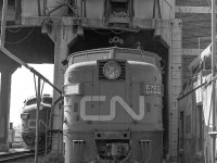 CN 6786 sits under the coaling tower at CN's Spadina Yard in Toronto somewhere between 1969 to 1971.