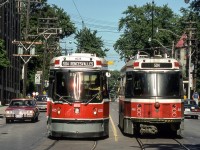 TTC 4025 and TTC 4168 are passing each other in Toronto on August 11, 1987.