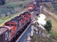 <br>
 <br>
...eight units....
<br>
 <br>
....five models...
<br>
 <br>
...three builders...
<br>
 <br>
...Geep 35's; C-424; SW1500; SD40-2's and a Geep 30
<br>
 <br>
...GMD...MLW...and an EMD....
<br>
 <br>
eastbound (on the bridge) CP Rail 5008 – 5019 – 5011 – 4221 with a SW 81xx 
<br>
 <br>
& westbound – in the hole, with 'year-lings' CP Rail 5798 – 5799 assisted by  C&O 3004 
<br>
 <br>
at the bridge over River Thames, with the westbound crew ready for the inspection, at Coakley,  September 9, 1979 Kodachrome by S.Danko
<br>
 <br>
MORE Geep 35's
 <br>
<br>
    <a href="http://www.railpictures.ca/?attachment_id=  47635">  neat lashup </a>
<br>
 <br>
sdfourty

