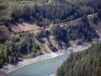 I find myself getting emotional looking back at these old slides, which I've pulled out every Photoshop trick I can think of to try and make them presentable. This reminds me a little of the model that used to be at the Ontario Science Centre. 3 SD40-2s are westbound in the Fraser Canyon, looking like less than a toy. In my head, I can still imagine Onderdonk et al blasting their way through the impossibilities of building a railroad through here in the 1880s. No roads, no electricity...just dynamite and will. Sure, those who ran the 4-4-0's of the day couldn't imagine 9000hp pulling a mile of containers, any more than I could envision 12000-foot stack trains with three units clogging up the railroad as they do today. Then, as today, it's an incredible sight, and a tribute to engineering and determination. But it was a lot more "human" then....the one really sad change.