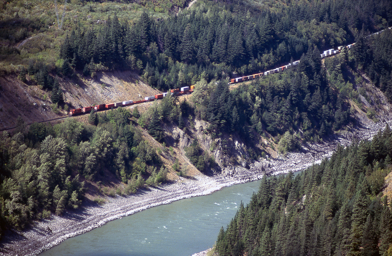 I find myself getting emotional looking back at these old slides, which I've pulled out every Photoshop trick I can think of to try and make them presentable. This reminds me a little of the model that used to be at the Ontario Science Centre. 3 SD40-2s are westbound in the Fraser Canyon, looking like less than a toy. In my head, I can still imagine Onderdonk et al blasting their way through the impossibilities of building a railroad through here in the 1880s. No roads, no electricity...just dynamite and will. Sure, those who ran the 4-4-0's of the day couldn't imagine 9000hp pulling a mile of containers, any more than I could envision 12000-foot stack trains with three units clogging up the railroad as they do today. Then, as today, it's an incredible sight, and a tribute to engineering and determination. But it was a lot more "human" then....the one really sad change.