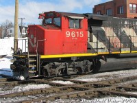 Well-worn CN GP40-2LW 9615 slams the CN-OBRY (ex-CP) <a href=http://www.railpictures.ca/?attachment_id=35631><b>Brampton diamond</b></a> as it heads west through downtown with the daily #145 Roadrailer train. The regular #144/145 and #147 (Fridays instead of #145) Roadrailers would usually pull a single unit for the assignment, often of the GP40 or SD40 variety, but sometimes something bigger such as an SD50F, SD75I or C40-8M would show up on point.<br><br>Long an annoyance for CN because of reduced speeds (and CP because they had to keep maintaining it, even into the OBRY era) the diamonds were <a href=http://www.railpictures.ca/?attachment_id=54724><b>finally removed</b></a> in early July 2024, a few years after the OBRY had run its final train. The <a href=http://www.railpictures.ca/?attachment_id=21752><b>final Roadrailer</b></a> ran in November 2015. CN 9615, sporting a new coat of paint, is still kicking around.