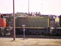 Not much of a photo but I am passing this along as an example of a rather sloppy placement of panels on the side of CN GMD-1 #1063. Perhaps these panels saved someone from bothering to find the right ones? Maybe nobody gave a hoot (polite word)?  Anyway, I found this rather amusing.  Also really sure of location, as it was nearly 50 years ago; but Walker Yard looks to be the best bet since I did see other interesting power at the same facility.