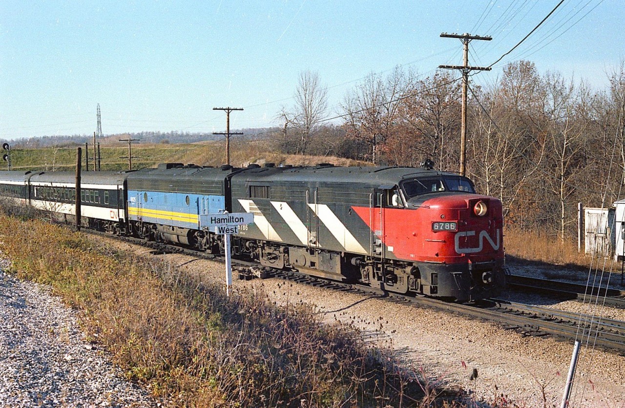 I'm not sure which eastbound passenger train this was, but by the look of the sun angle it might be #74. It was nice to catch some of those old F units still in CN paint, as VIA was just taking a foothold and eventually most of the passenger equipment would get painted over to the blue & yellow scheme. The 6786 is assisted by what appears to be VIA 6625.