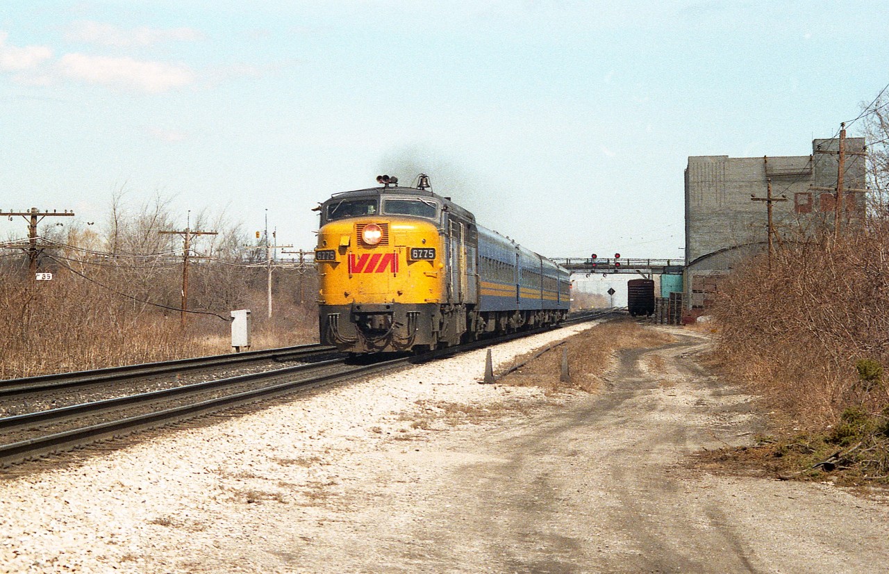A clean morning image of VIA 6775 west rolling past the old Aldershot Cold Storage building. The building has been long demolished and the vantage point here at the end of Howard Rd has been obliterated by the third track that was put in to accommodate improved GO service to Hamilton and Niagara. The train is too small to be a #73, so I am thinking it is a morning #71. I didn't make proper notes.
After #6775's days were done in Canada, it shuffled off to Napa Valley in California to take on the tourist biz down there.
Thats the Waterdown Road bridge in the background.