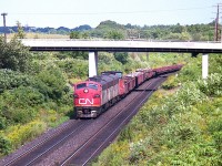 Westbound under the Old Guelph Rd bridge, CN #725 makes its way toward Nanticoke from Hamilton. I am standing on the walk bridge over the line that connects the Royal Botanical Gardens to Homestead Av, where I parked at the end. It is all "no parking" but I figured I could get away with 10 minutes or so.  The power is CN 9166, 9195 and 9177, a nice A-B-A set. Next chance I had to catch this train was a week later and the 9177 had been replaced by GP9 4572. I'm glad I didn't take those old warriors for granted.