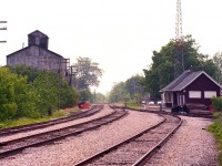 Quite a few photos around regarding Caledonia station, but I notice most of them are shot looking NW along the line. Here's one looking SE along what was the old Dunnville Sub.  On the right is the Caledonia station, and on the left there is now a modern Food Basics occupying the lands. The track now ends at Argyle St. N. (just visible)  and the extension of the old Dunnville line is now history.
Information on the old structure on the left would be appreciated. Was this building lost to a fire?