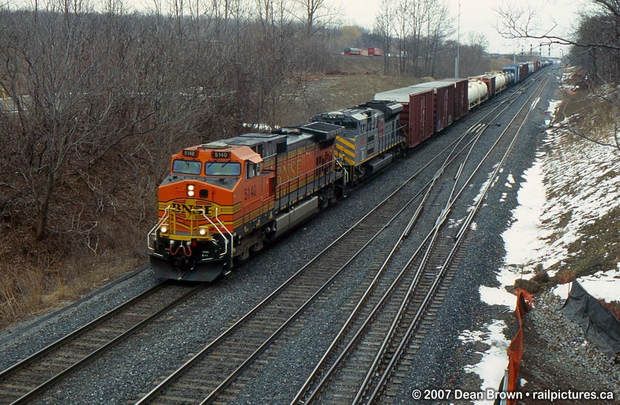 CN 393 with BNSF C44-9W 5140 and KCS SD70ACe 4020.