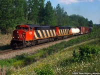 CN SD60F 5534 and CN Dash 8-40CM 2424 seen at Mile 30 on the CN Halton Sub.