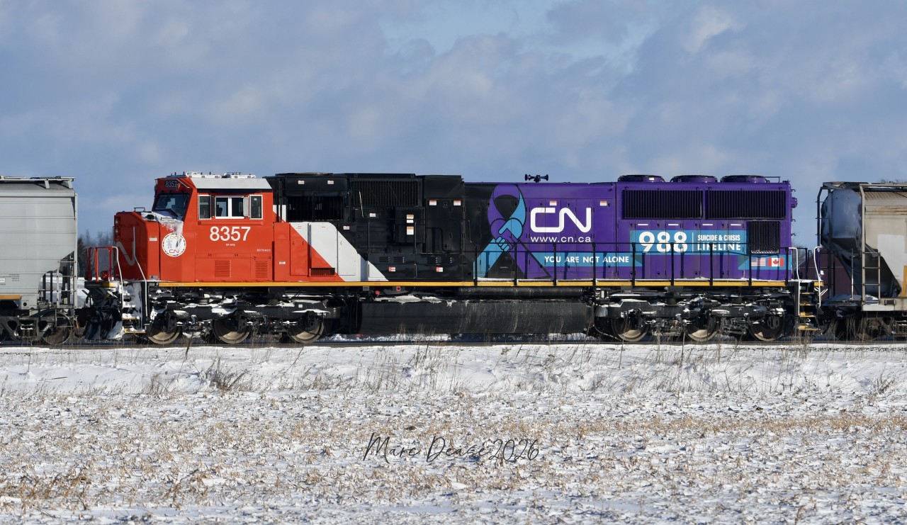 Making its long awaited appearance in Southern Ontario is CN 8357 SD75IACC rebuild, painted in the Suicide & Crisis Lifeline livery. It arrived in Sarnia, ON., today, January 20, 2026, as the mid DPU unit on grain train 874 heading east on the Strathroy Sub.