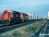 CN SD40u 6007 and SD40 5204 are pictured leading a westbound stack train along the Oakville Subdivision passing through Aldershot, Ontario. This train was likely heading for Buffalo, New York, via the CN Grimsby Subdivision.